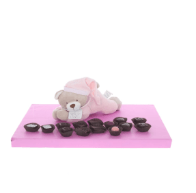 Pink lying teddy with display of Belgian chocolates