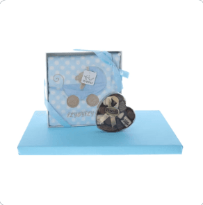 Blue blanket with heart-shaped box of dairy pralines